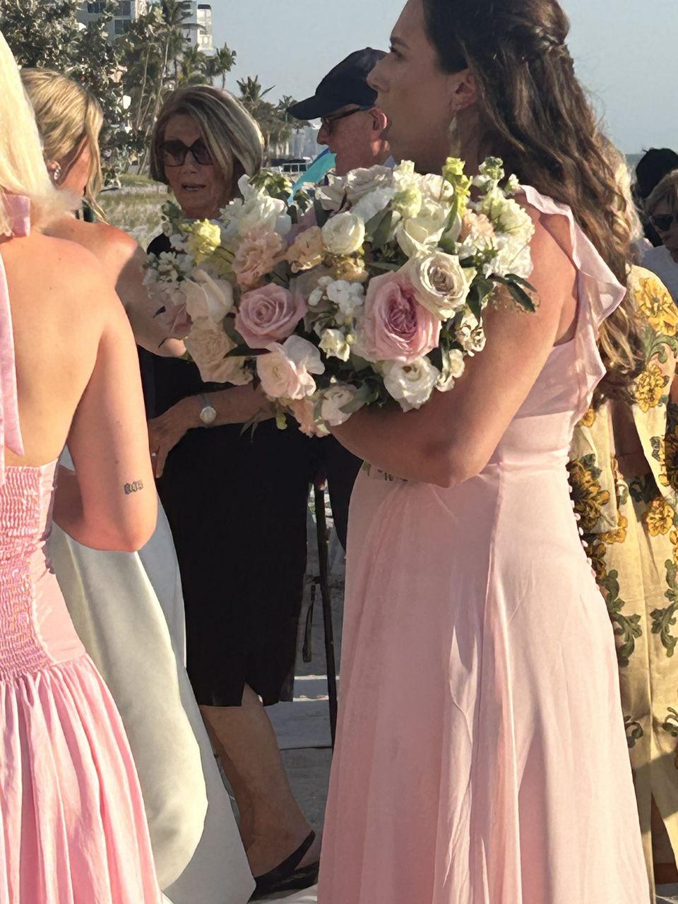 Bridesmaid holding a blush garden-style bouquet